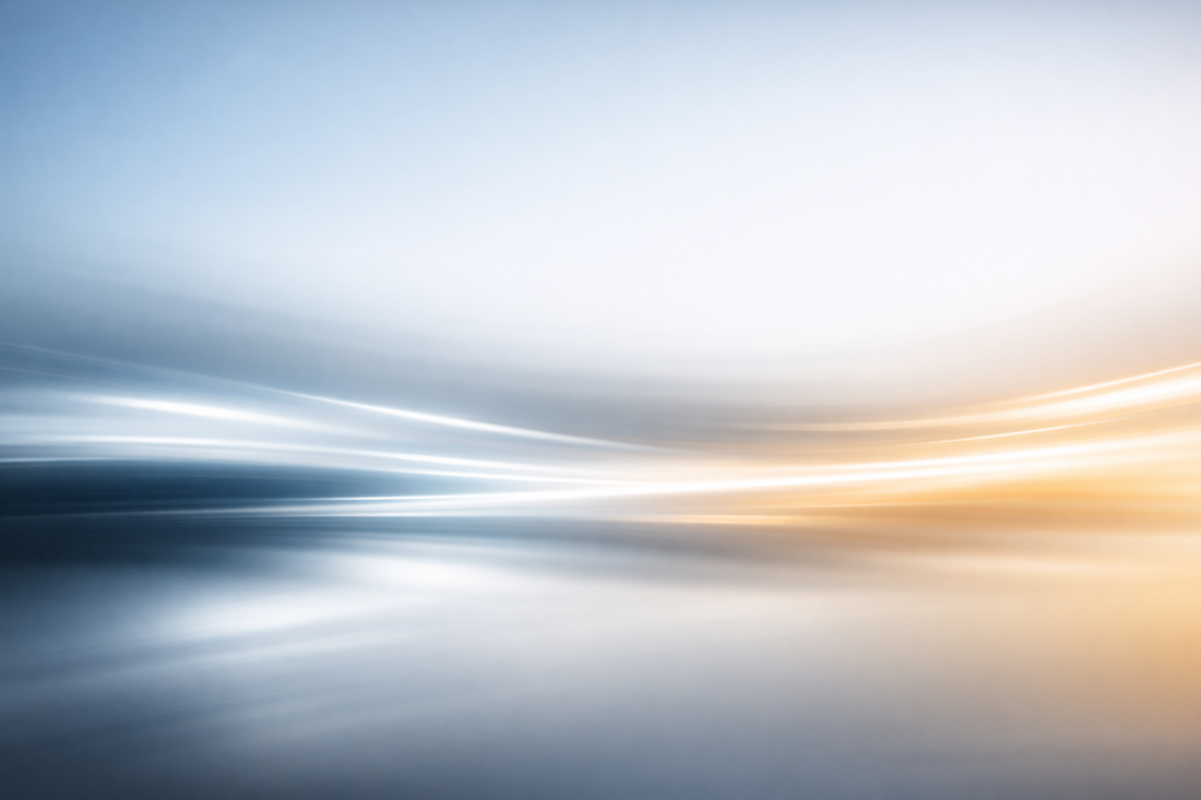 Abstract motion light background showing smooth streaks of cool blue and warm golden light flowing horizontally, symbolising clarity, movement, and reconnection in VARELO™’s The Way Back philosophy.