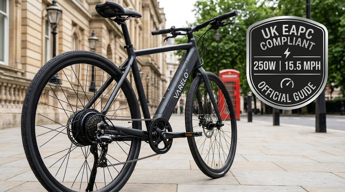 Black VARELO electric bike parked on a modern UK city street displaying a silver UK EAPC Compliant badge with 250W and 15.5 mph road-legal limits.