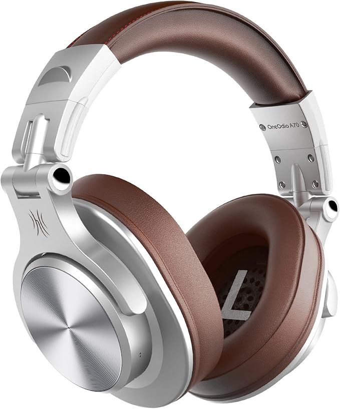 OneOdio Fusion A70 Silver Brown wireless DJ headphones featuring plush over-ear cushions, swiveling earcups, USB charging cable, 3.5mm audio lead, and 6.35mm jack connector.