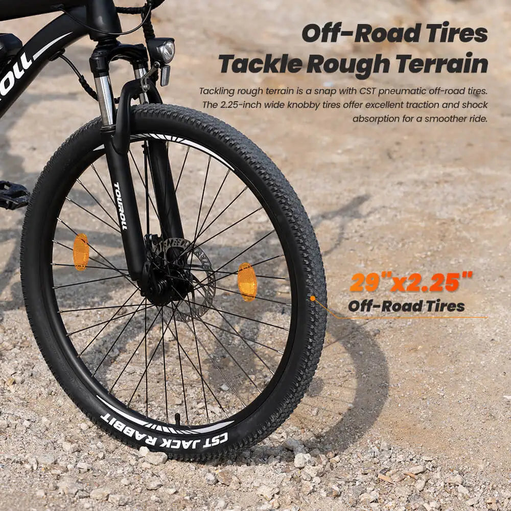 Electric Bicycle wheel with off-road tires on a gravel surface, featuring text about tire performance.