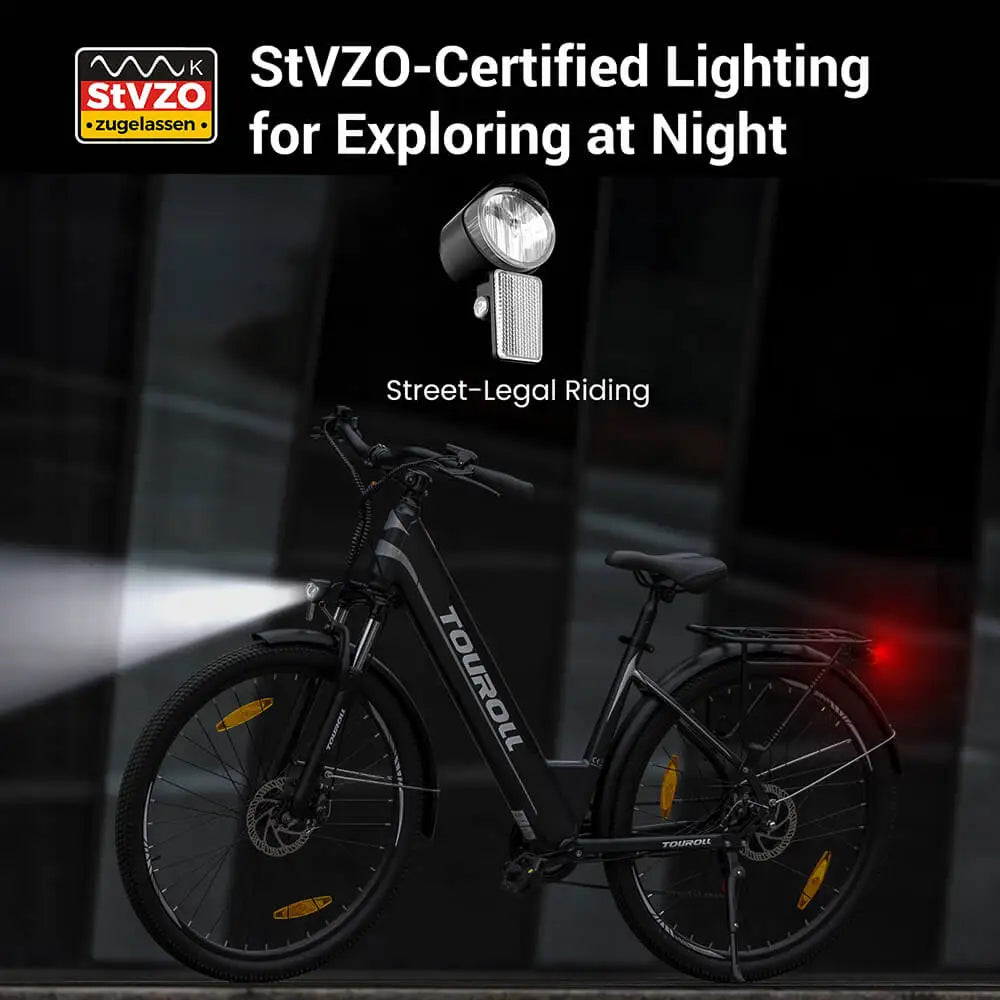 Electric bike with a headlight on a dark background, featuring StVZO certification.
