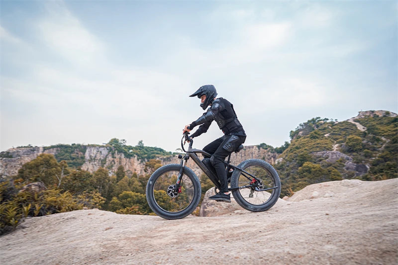 Person riding an electric bike on a scenic background