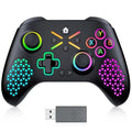 Black gaming controller with colorful buttons and a USB receiver on a white background