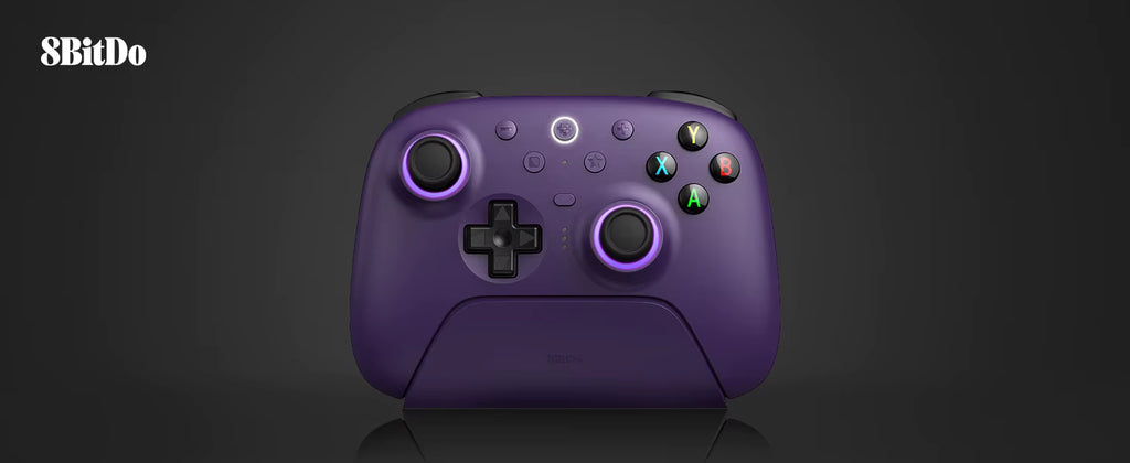 Studio product shot of the 8BitDo Ultimate 2 Wireless Controller in purple, docked neatly on its magnetic charging stand against a clean dark grey background with the 8BitDo logo in the upper corner.