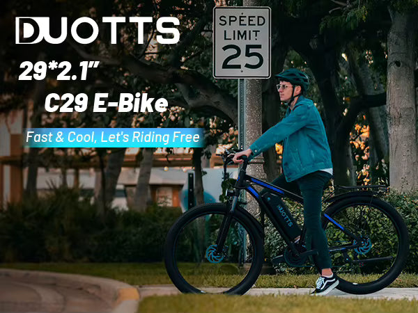 DUOTTS C29 Electric Bike Promotional Lifestyle Image Showing Rider Outdoor with 29x2.1 Inch Tire Size Text and Speed Limit Sign