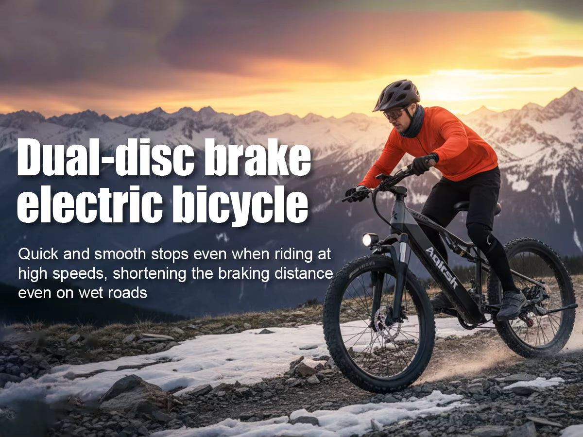 Person riding a dual-disc brake electric bicycle with mountains in the background