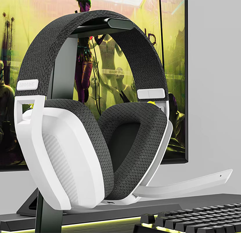 Product showcase shot of the gaming headset resting on a desk stand in a gaming setup