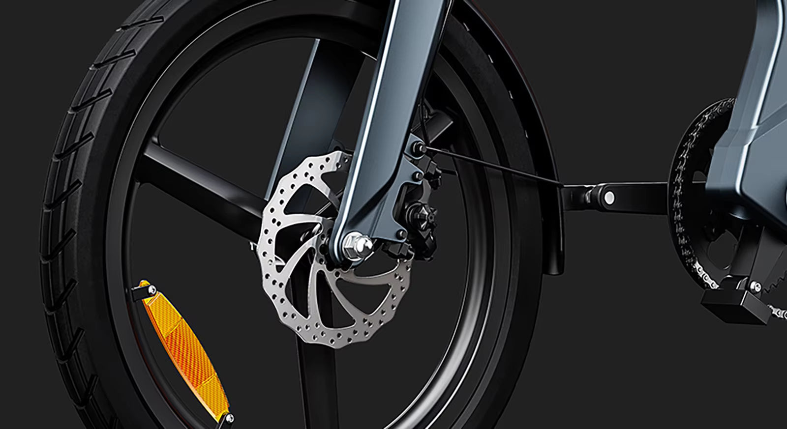 Close-up of a electric bicycle wheel with disc brake system on a dark background