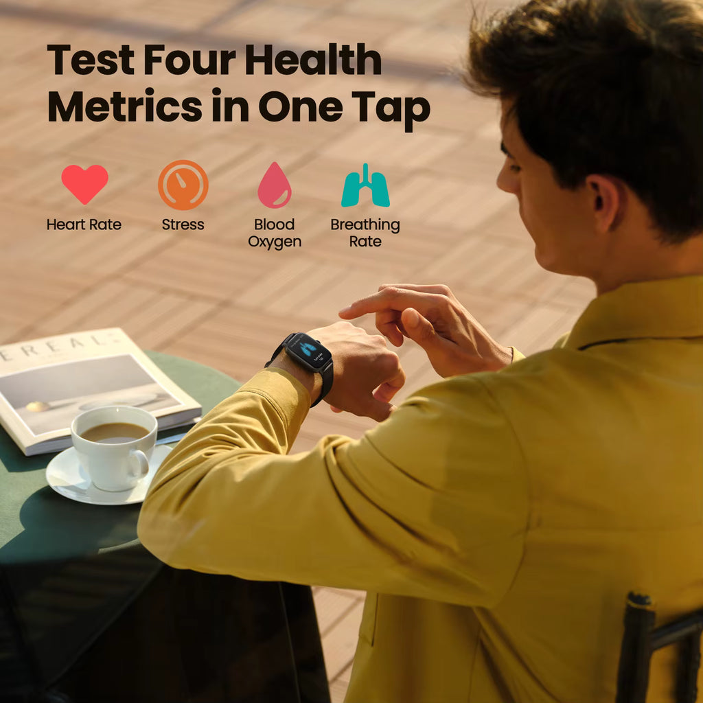 Person using a smartwatch with health metrics displayed, sitting at a table with a book and coffee.