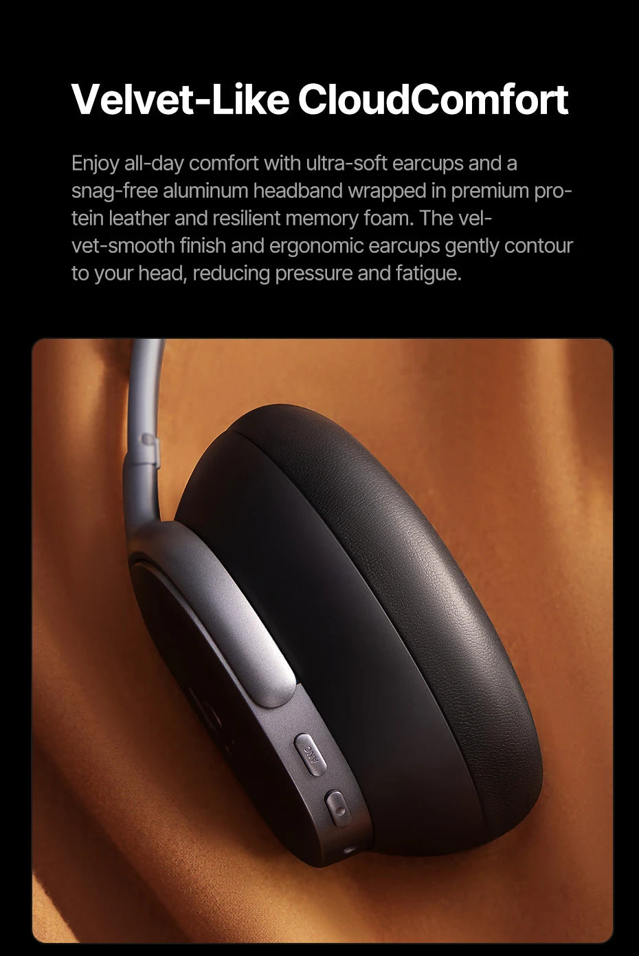 Black Baseus Inspire XH1 over-ear headphones with text about Velvet-Like CloudComfort on a wooden surface