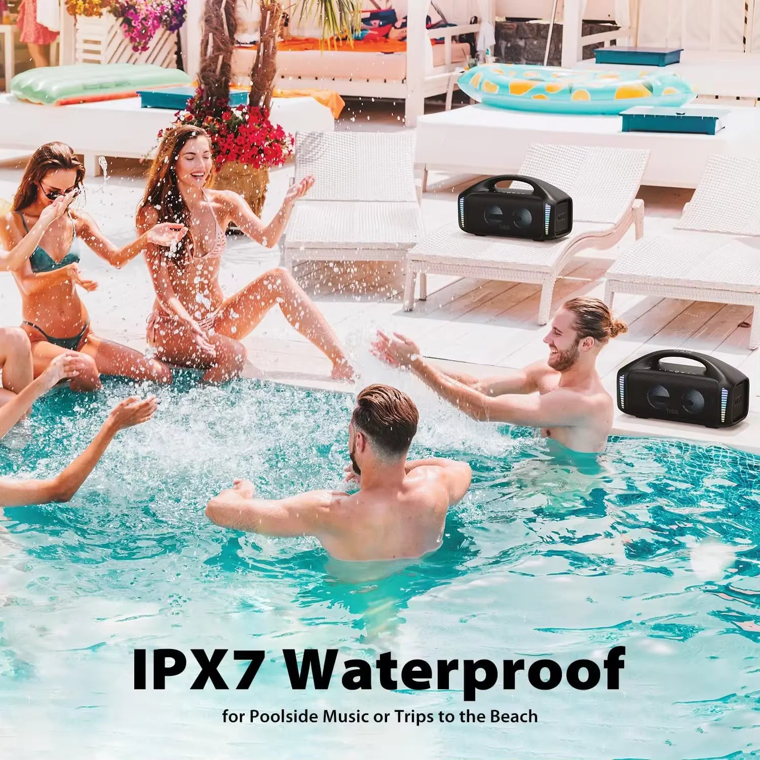 People enjoying a pool party with Tribit StormBox Blast waterproof speakers, text 'IPX7 Waterproof'.