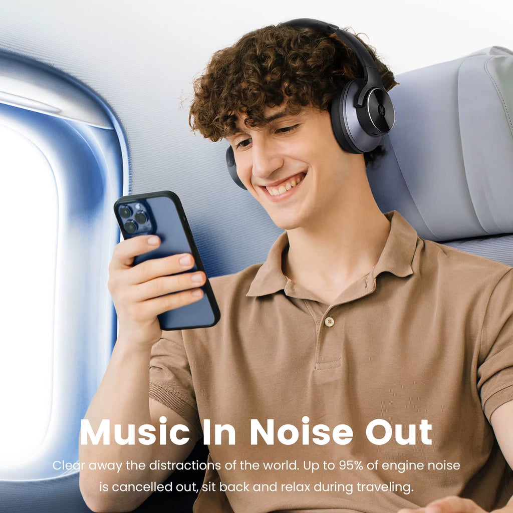 Person wearing OneOdio A10 Hybrid ANC Over-Ear Bluetooth headphones and using a phone with text 'Music In Noise Out' on an airplane.
