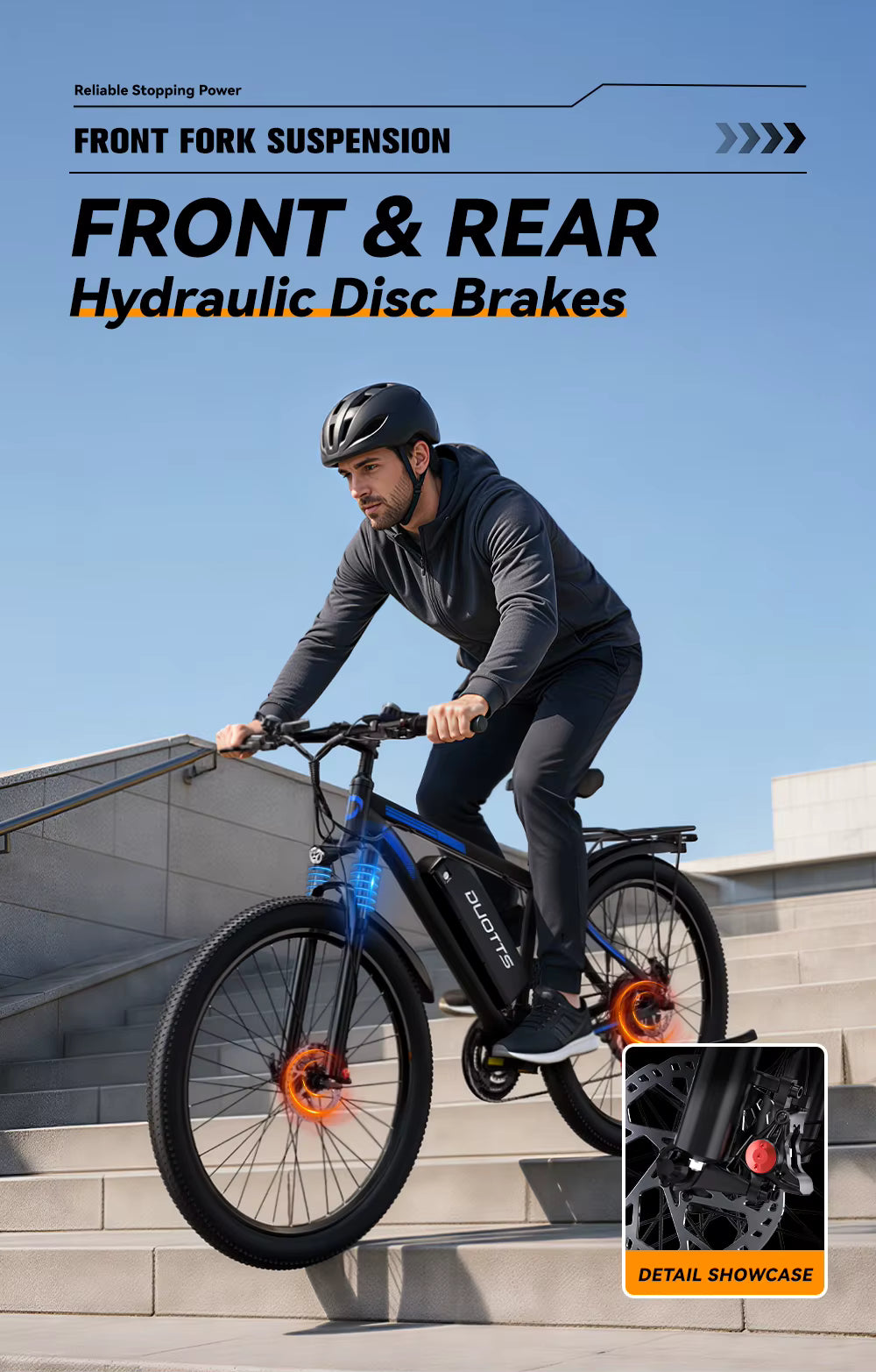 Person riding a bicycle with front and rear hydraulic disc brakes on a clear day.