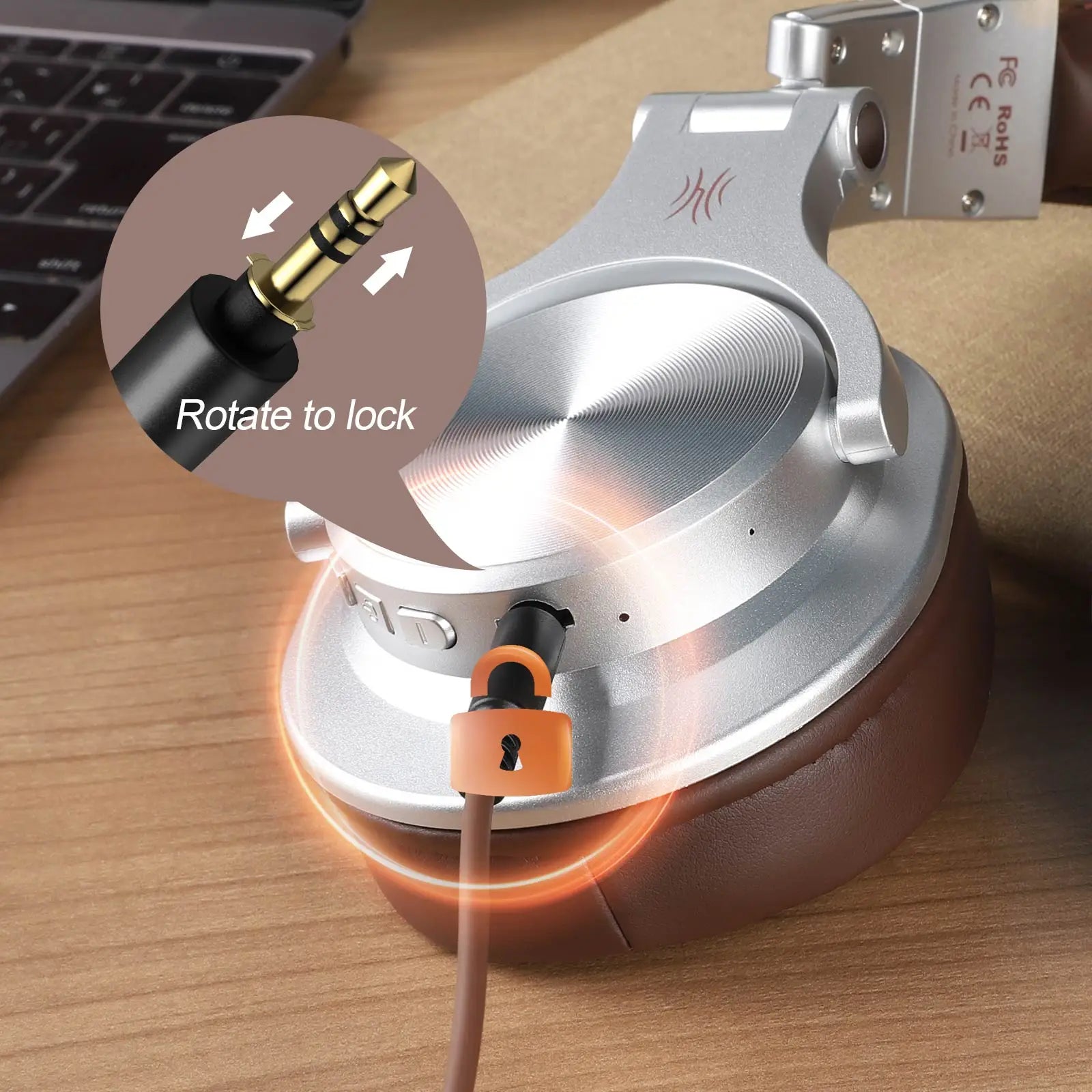 OneOdio Fusion A70 headphones with cable on a wooden surface, showing how to rotate for locking.