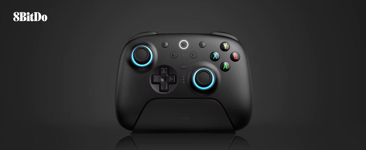 Studio product shot of the 8BitDo Ultimate 2 Wireless Controller in black, docked neatly on its magnetic charging stand against a clean dark grey background with the 8BitDo logo in the upper corner.