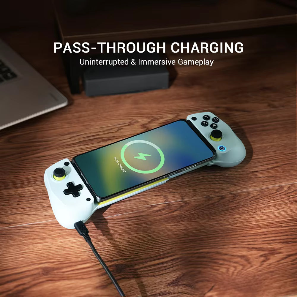 Game controller with phone pass-through charging on a wooden surface, with text 'Pass-Through Charging' and 'Uninterrupted & Immersive Gameplay'.