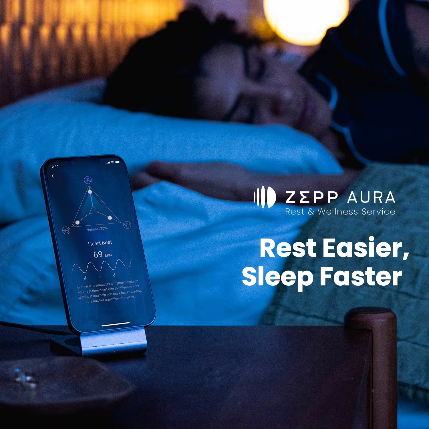 Person lying in bed with a smartphone displaying the Zepp Aura app, indicating rest and wellness service.