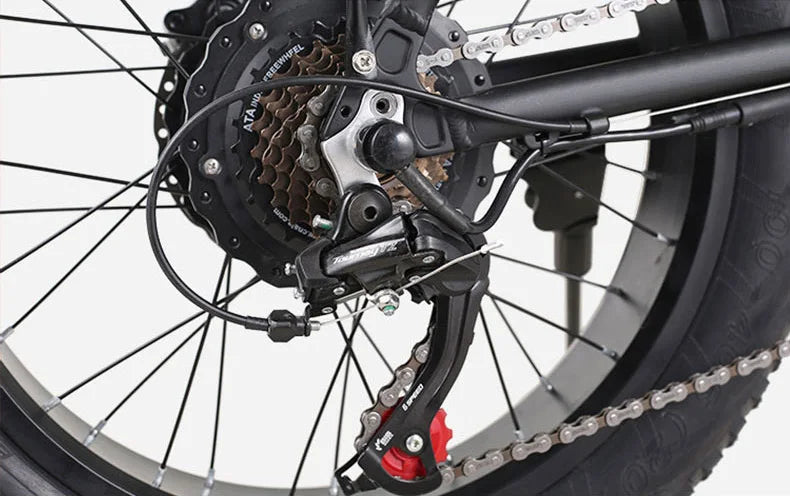 Close-up of a AVAKA BZ20 PLUS Foldable E‑bike  bicycle wheel with gear and chain mechanism on a white background