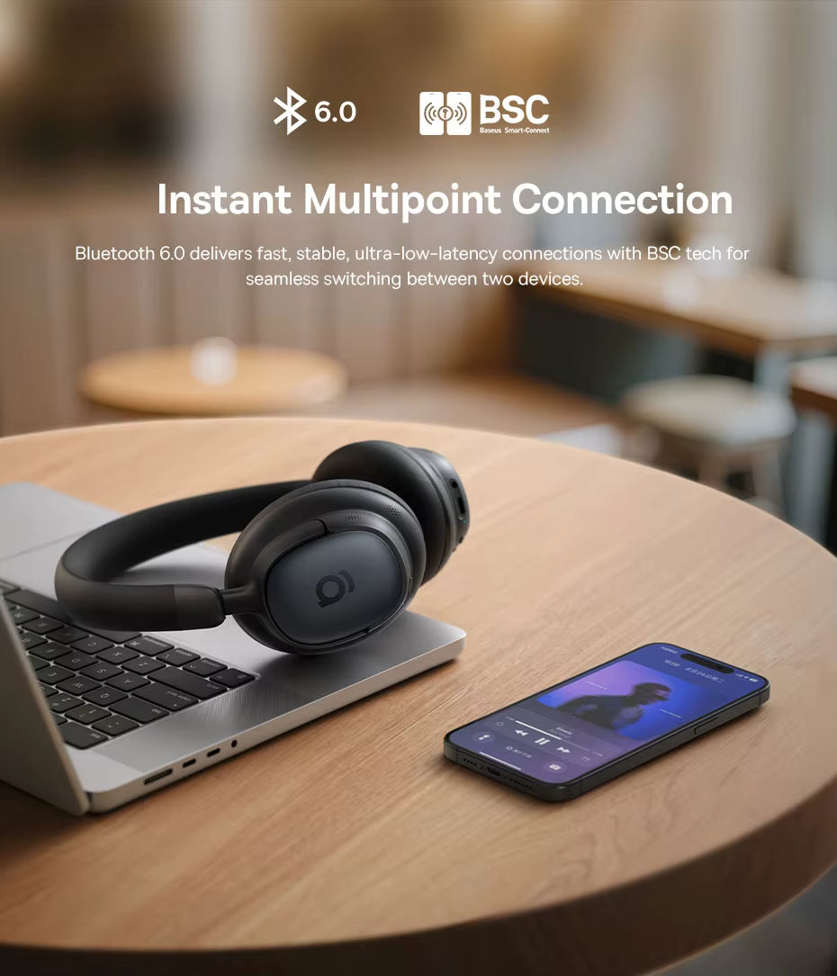 Baseus Bowie MH1 headphones placed on a laptop beside a smartphone on a wooden café table, with the heading “Instant Multipoint Connection” and icons for Bluetooth 6.0 and BSC technology, highlighting fast, stable, ultra‑low‑latency wireless connectivity and seamless switching between two devices.