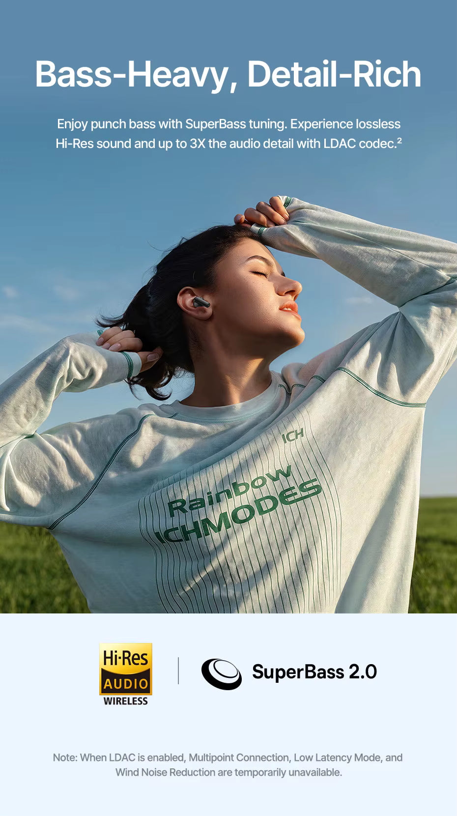 Person wearing a white sweatshirt with 'Rainbow Modes' text, standing in a field with promotional text about audio features for Baseus EP10 earbuds