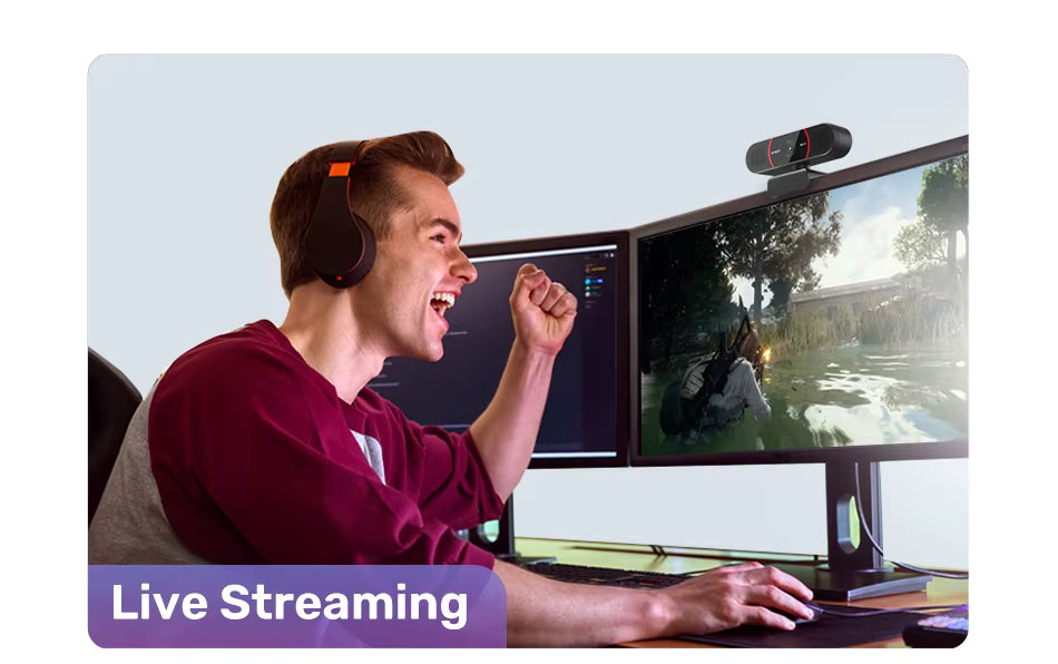 EMEET 4K USB webcam mounted on dual gaming monitor setup with gamer wearing headphones during live streaming session