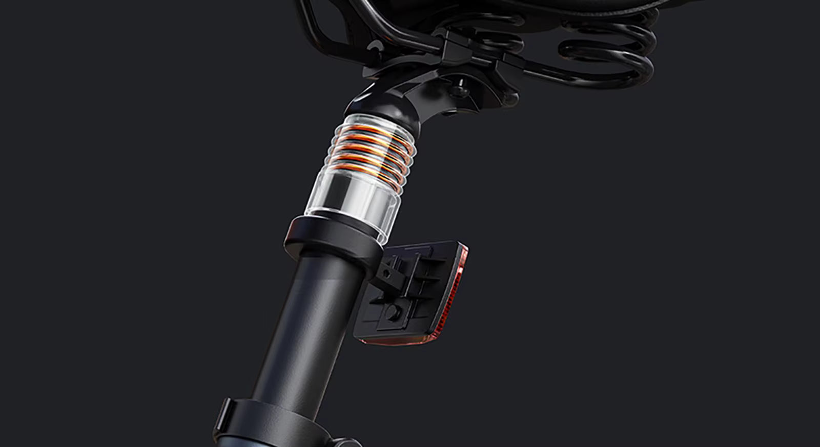Close-up of an electric bicycle suspension system on a black background