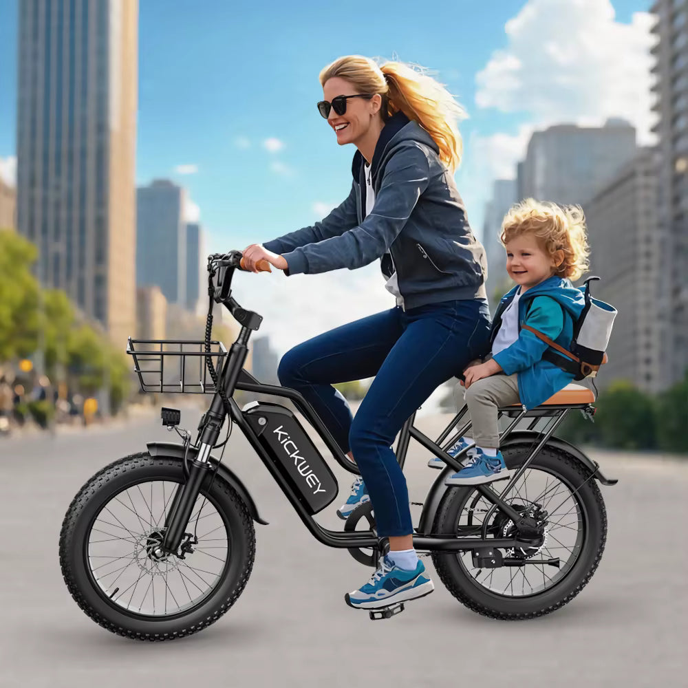 Woman riding an electric Kickwey bike with a child in a front seat on a city street.