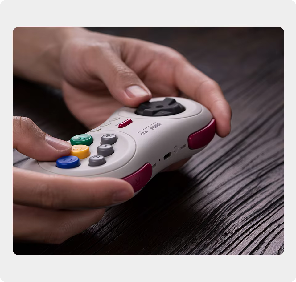 8BitDo M30 Bluetooth Controller Retro Grey In-Hand Close-Up