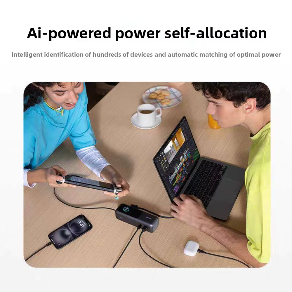A promotional graphic with the headline 'Ai-powered power self-allocation' above a lifestyle scene of two people seated at a wooden table using a portable power station to charge a laptop, smartphone, and earbud. The image includes marketing text and a light gray outer background.