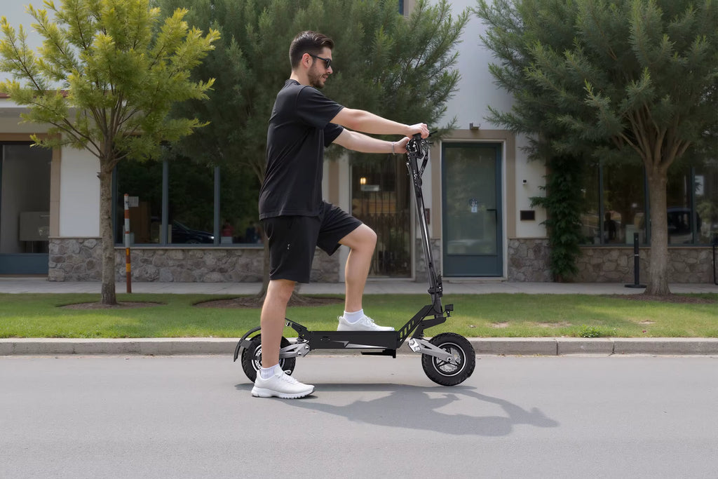 Person riding an electric scooter on a street with buildings and trees in the background