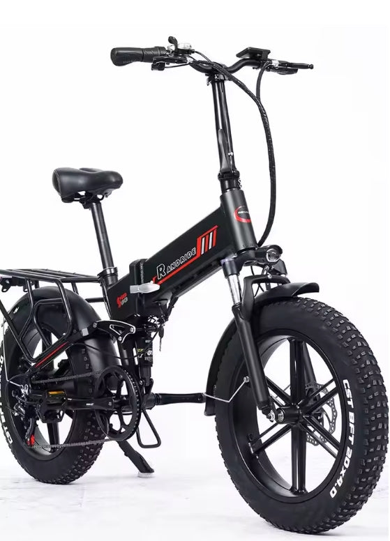 The image shows the RANDRIDE YX20M foldable electric bike in black with red detailing. It features a compact alloy frame, thick 20×4.0 inch CST tyres, front and rear suspension, and hydraulic disc brakes. The bike includes a rear rack, Shimano 7‑speed drivetrain, and visible wiring for its 1000W motor and 48V 17Ah lithium battery. The design highlights strength, portability and modern e‑bike engineering — ideal for urban and off‑road riders seeking high performance with foldable convenience.