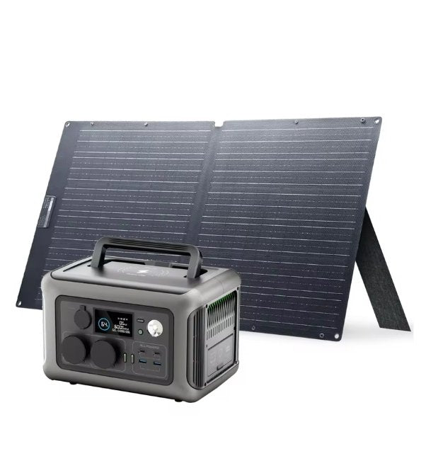 A portable power station with a handle and digital display in front of a foldable black solar panel on a white background.