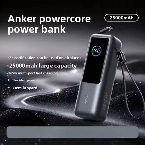 Anker powercore power bank in dark gray metallic finish with a black front display showing 100% battery, set against a dark textured background with promotional text highlighting 25000mAh capacity and 165W fast charging.