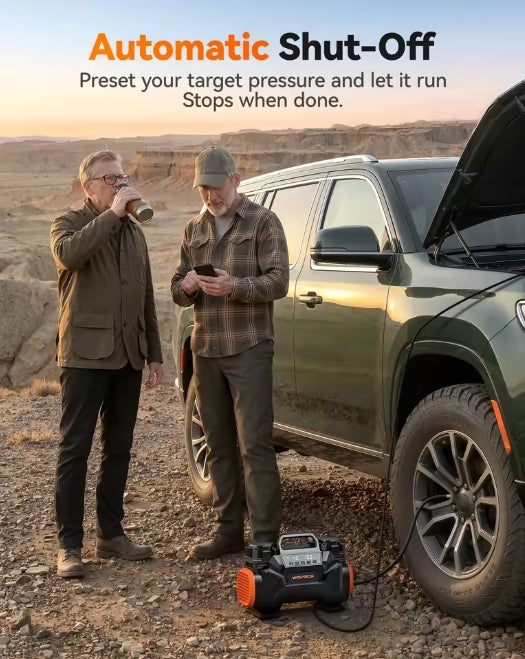 Camp scene showing automatic pressure shut-off feature in action with two users watching a 4x4 tire inflate