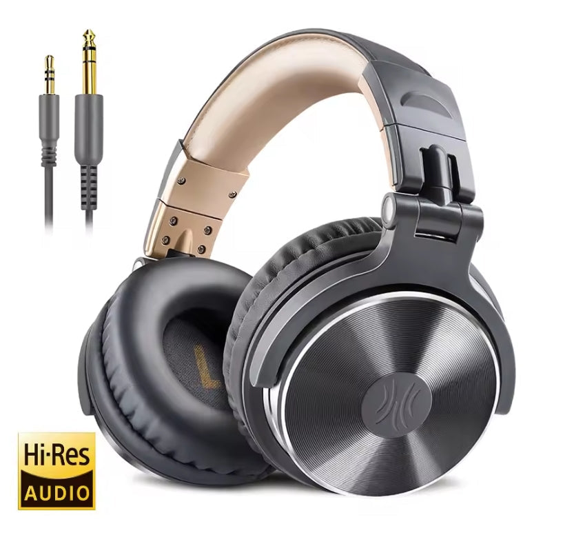 Over-ear wireless headphones in black and metallic gold, shown with a 3.5mm audio cable on a white background.