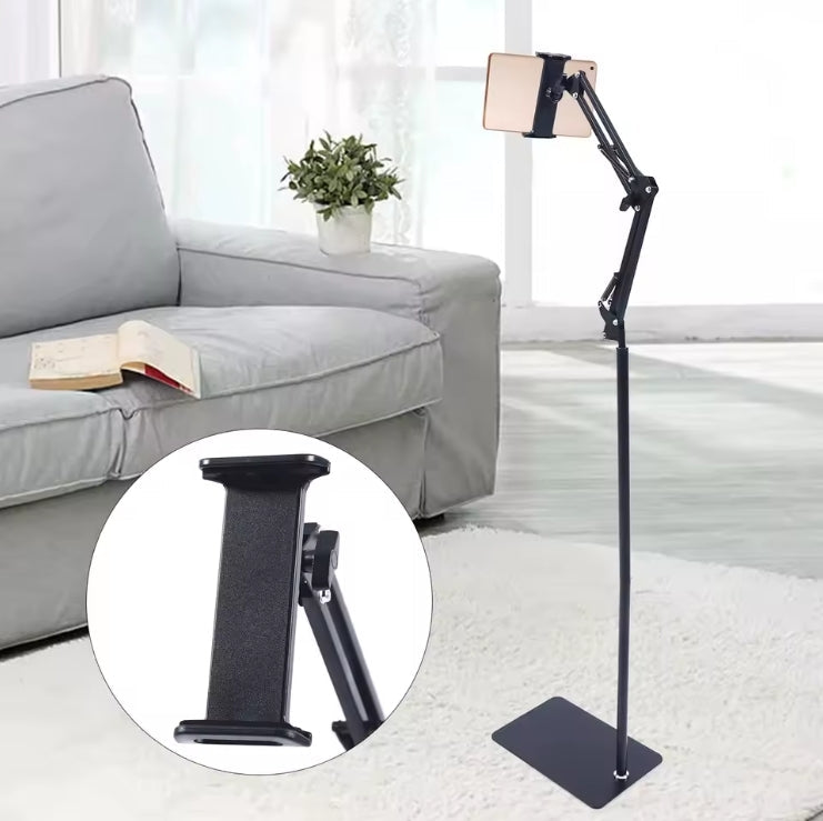 Universal Adjustable Floor Tablet Bracket placed next to a living room sofa with a tablet mounted   