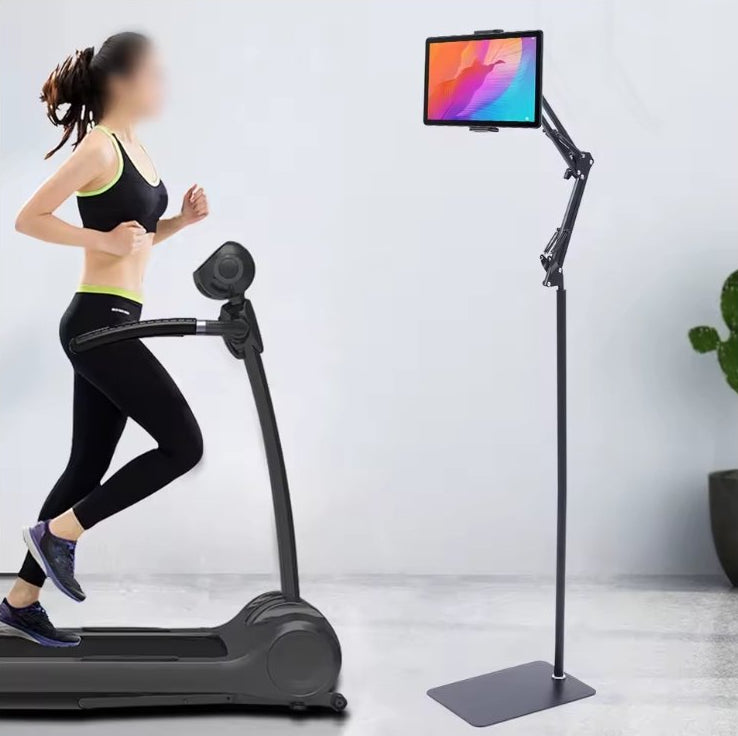 Universal Adjustable Floor Tablet Bracket in use beside a treadmill during a workout   