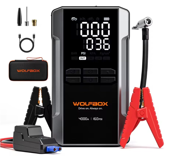 Wolfbox jump starter with pressure gauge and related tools on a white background