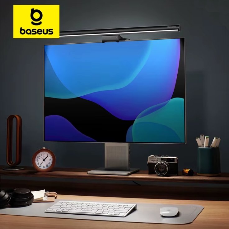 Computer monitor with lightbar on a desk with Baseus logo in the corner