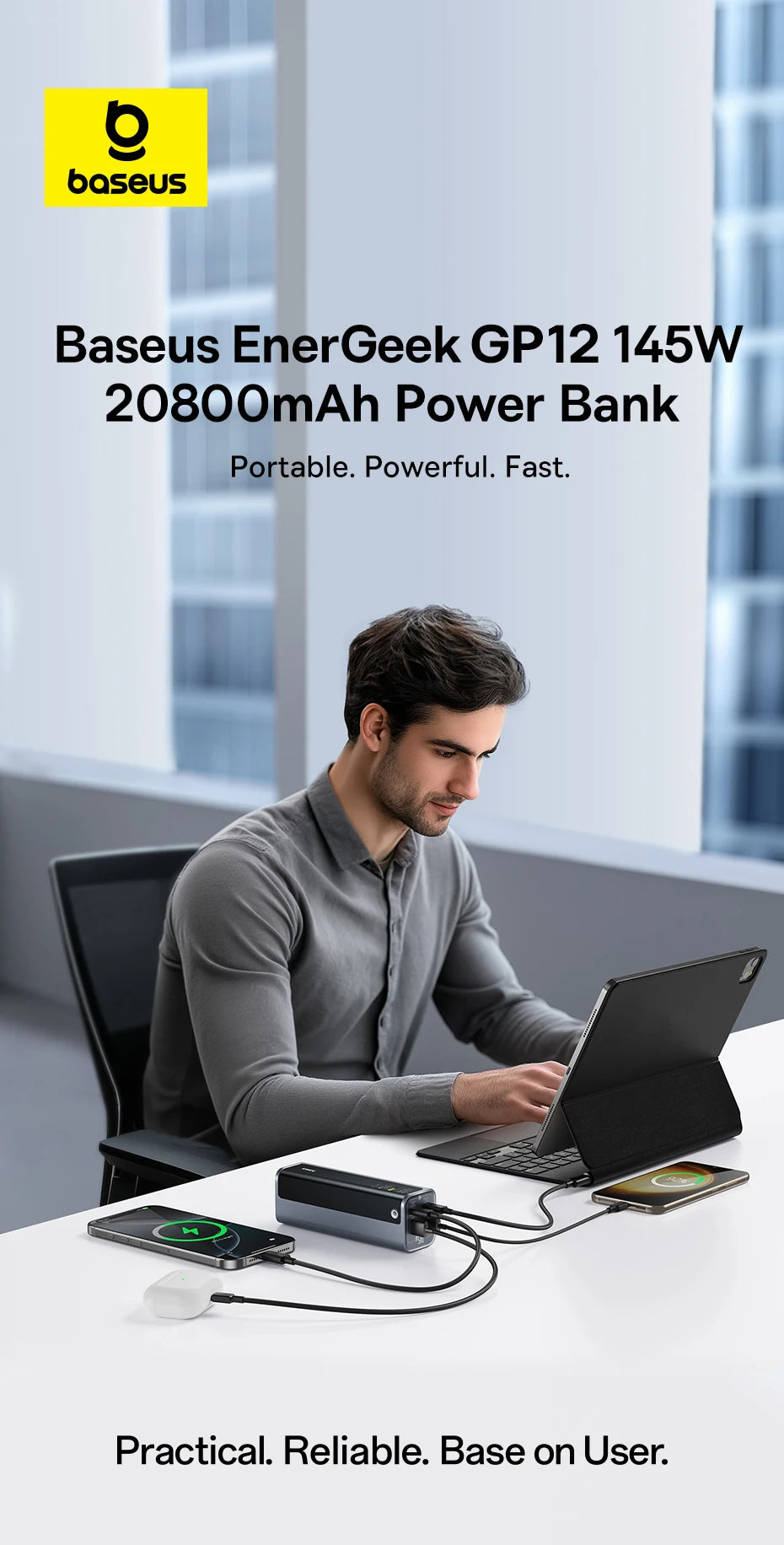Baseus EnerGeek GP12 145W 20800mAh Power Bank charging a laptop, smartphone, and earbuds simultaneously on an office desk.