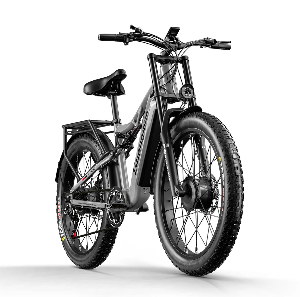 Frontal view of an electric bicycle with fat tyres on a white background