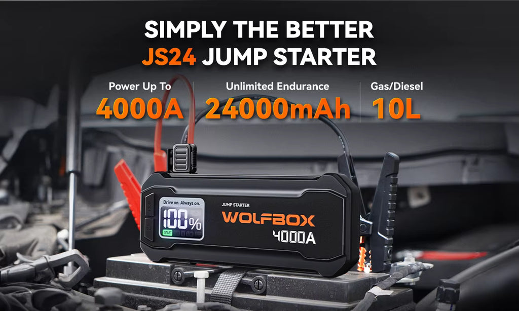 Wolfbox JS24 jump starter with power display on a car engine background
