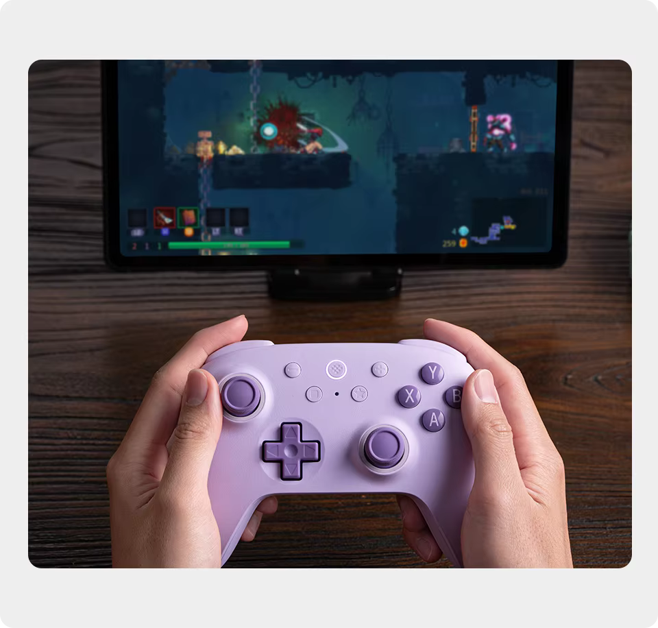 Person playing a game on a tablet with a lilac controller
