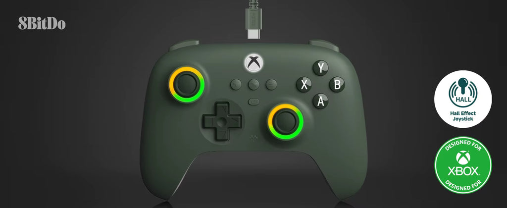 Dark green 8BitDo Xbox‑compatible wired controller featuring dual Hall Effect joysticks with yellow‑green illuminated rings, D‑pad, ABXY buttons, and central Xbox logo; includes Hall Effect and Designed for Xbox certification badges.