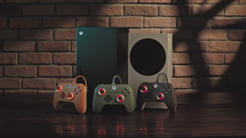 Video showing actual gameplay using the 8BitDo Ultimate C Wired Controller in front of a laptop, featuring close-ups of the tactile buttons, Hall Effect joysticks, and vibrant RGB Fire Ring lighting.