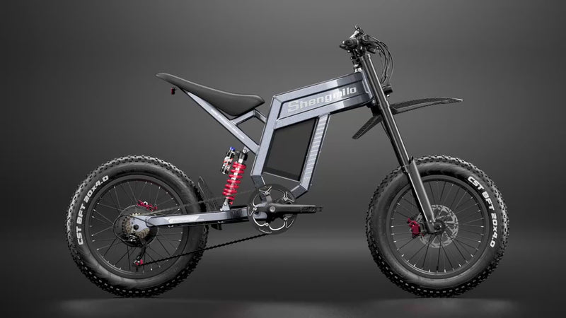 Electric mountain bike rotating on a white turntable showing full 360 degree view of the frame tyres battery area and overall design for this e-bike