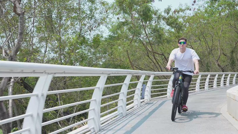Product showcase video for the Aairsk GT900 full suspension electric mountain bike. The video demonstrates the bike's dual-shock suspension, 26-inch Kenda tyres, integrated battery design, LCD handlebar meter, and smooth road-legal pedal-assist performance in action.