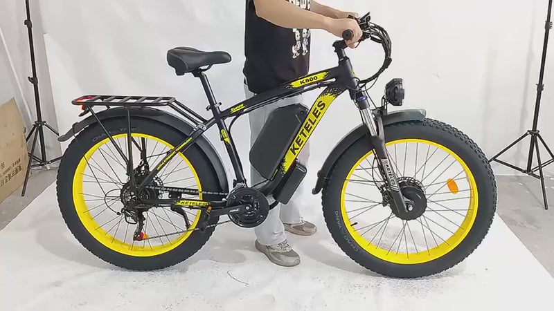 Man lifting the electric bike to show its weight, powering the bike on, and displaying close up views of the frame, controls and components from different angles.