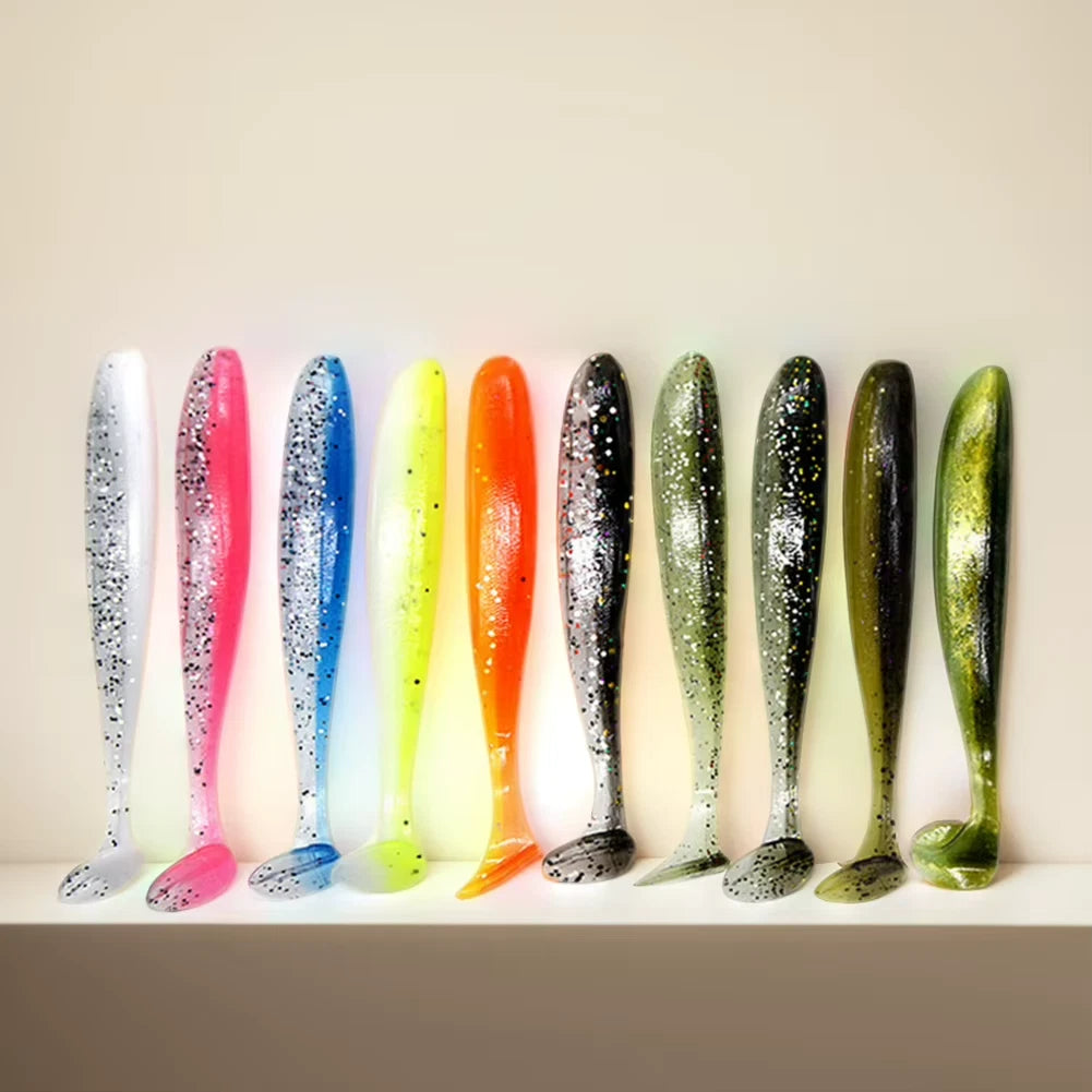 Row of colorful fishing lures on a white surface with a beige background