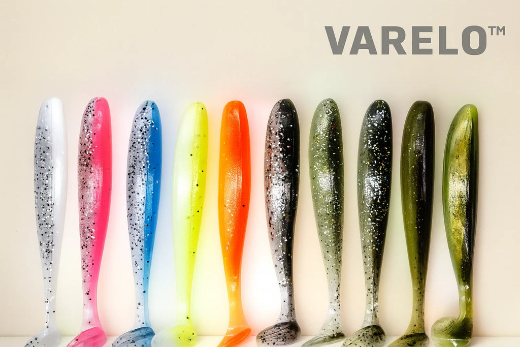 Colorful fishing lures with Varelo branding on a light background